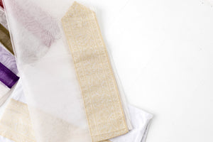 Tallit- Dainty white organza tallit with multicolored stripes.